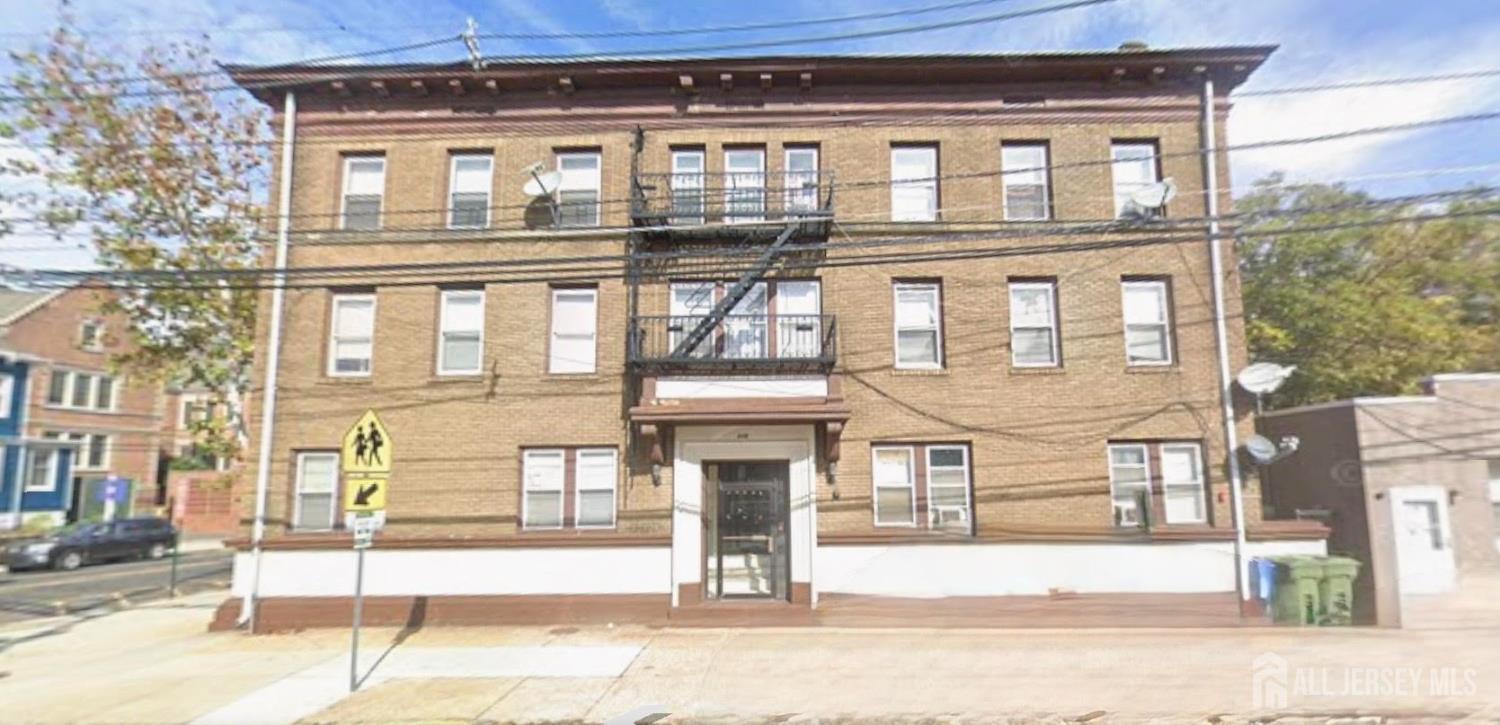 110 Market Street, Unit 3E Perth Amboy, NJ 08861 - Photo 1 of 5 a front view of a building