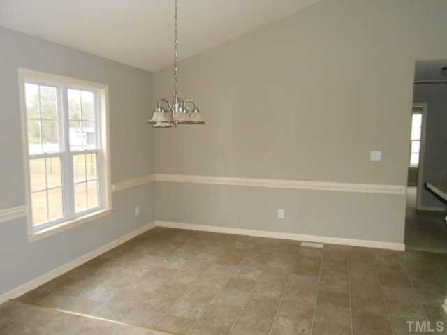 295 Axum Road Willow Spring, NC 27592 - Photo 4 of 8 a view of a room with window