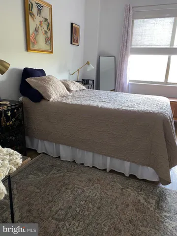 a room with furniture pool table and window