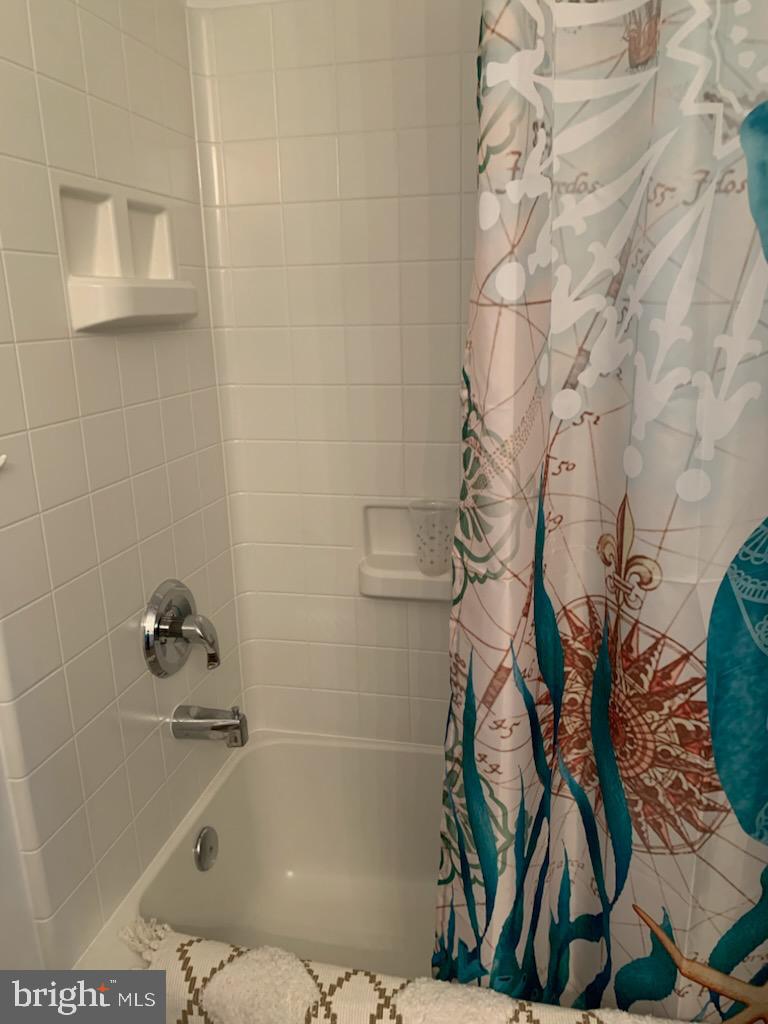 3200 North Leisure World Boulevard, Unit 514 Silver Spring, MD 20906 - Photo 21 of 26 a bathroom with a bathtub and shower