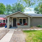 a view of house with outdoor seating area