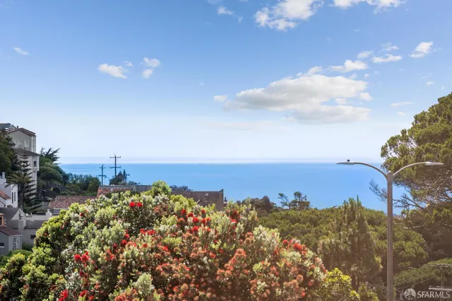 a living room with fireplace furniture and a window
