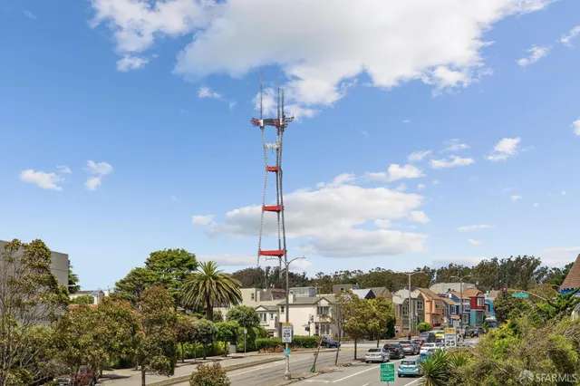 a living room with furniture or couch and a potted plant