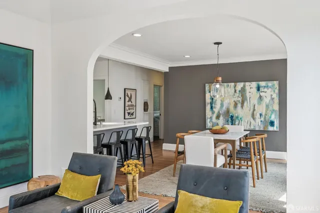 a dining room with furniture and window