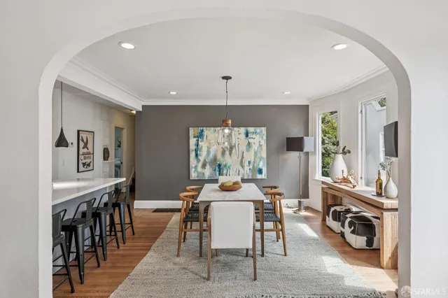 a dining room with furniture and window