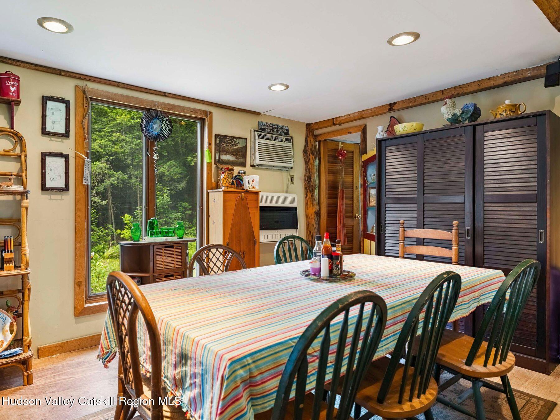 325 Brand Road Conesville, NY 12076 - Photo 11 of 36 a view of a dining room with furniture window and outside view