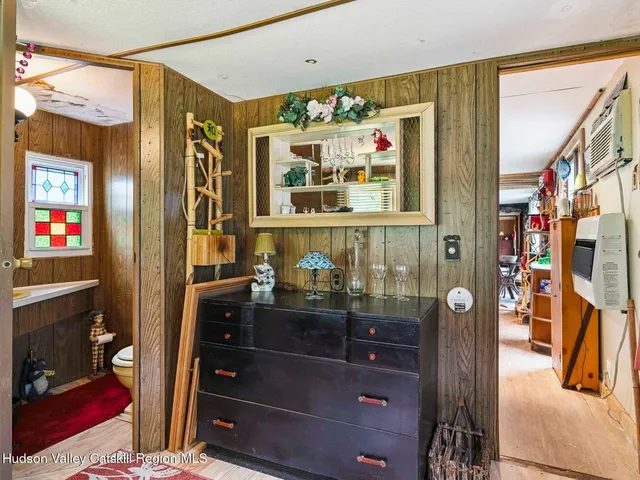 a bathroom with a sink a mirror and shower