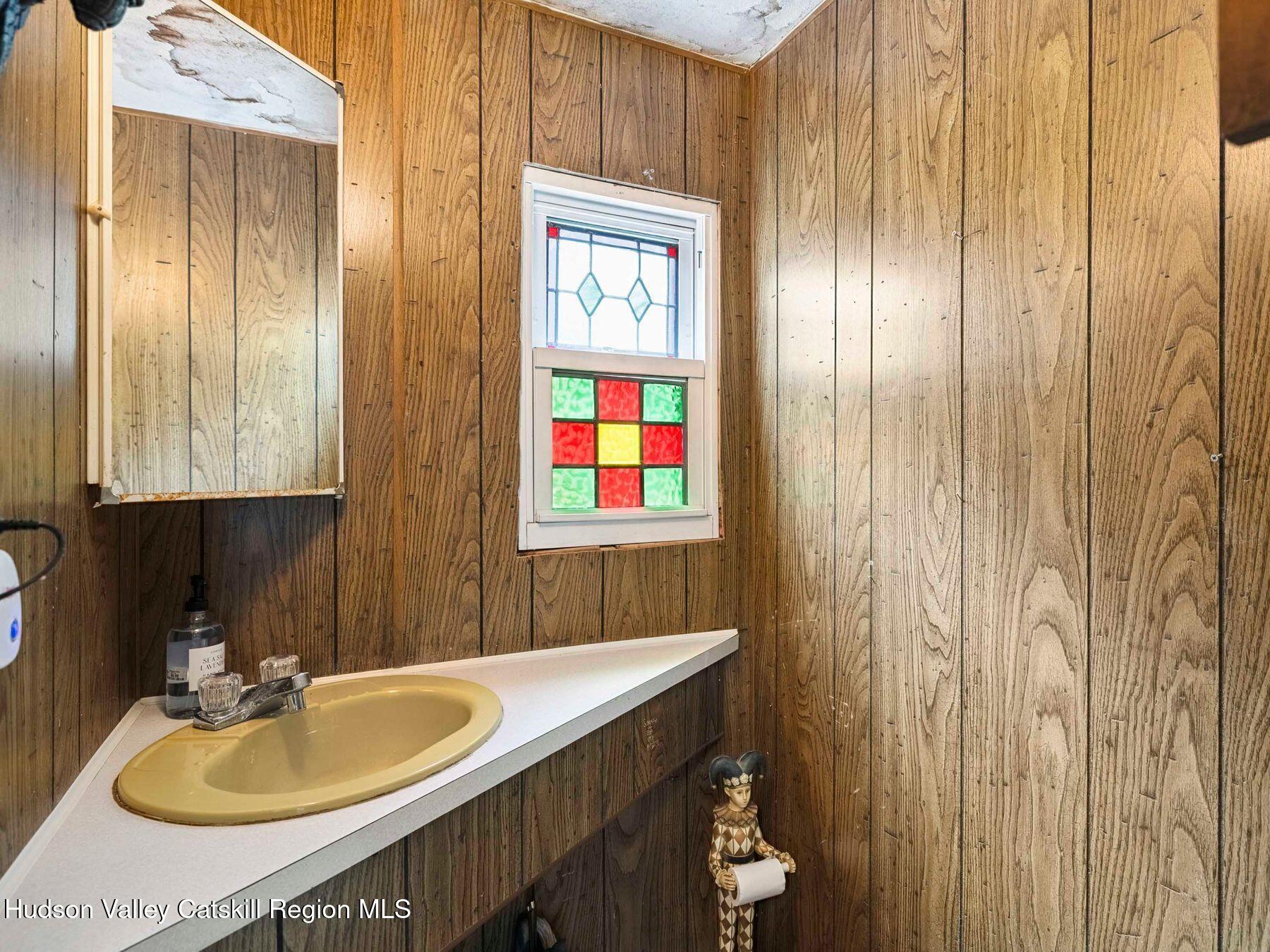 325 Brand Road Conesville, NY 12076 - Photo 20 of 36 a bathroom with a sink and a mirror