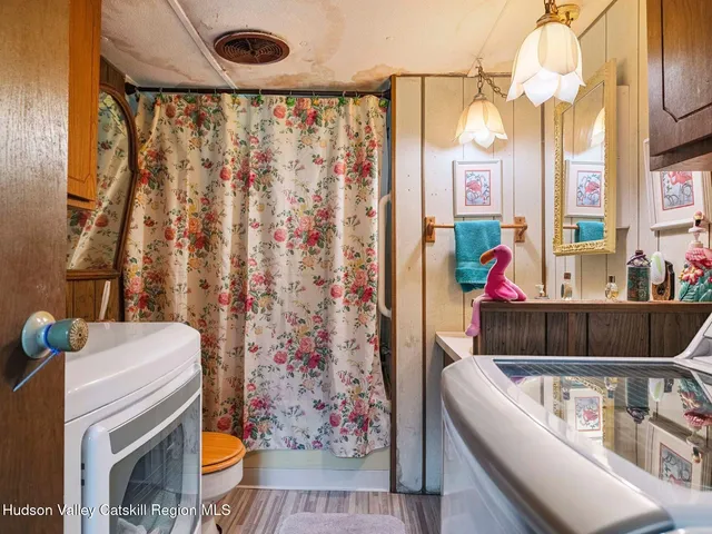 a living room with a couch and a chandelier