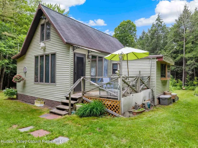 a view of backyard with a patio and garden