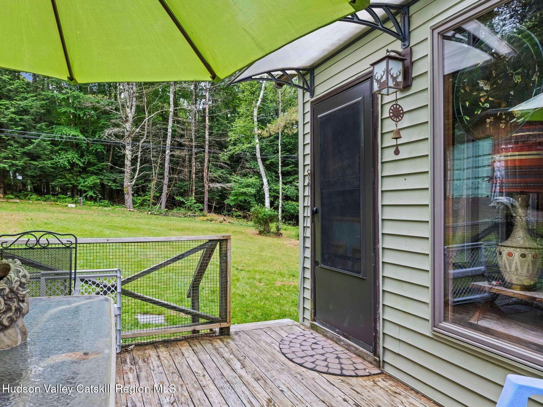 325 Brand Road Conesville, NY 12076 - Photo 6 of 36 a view of a chairs and table in the balcony