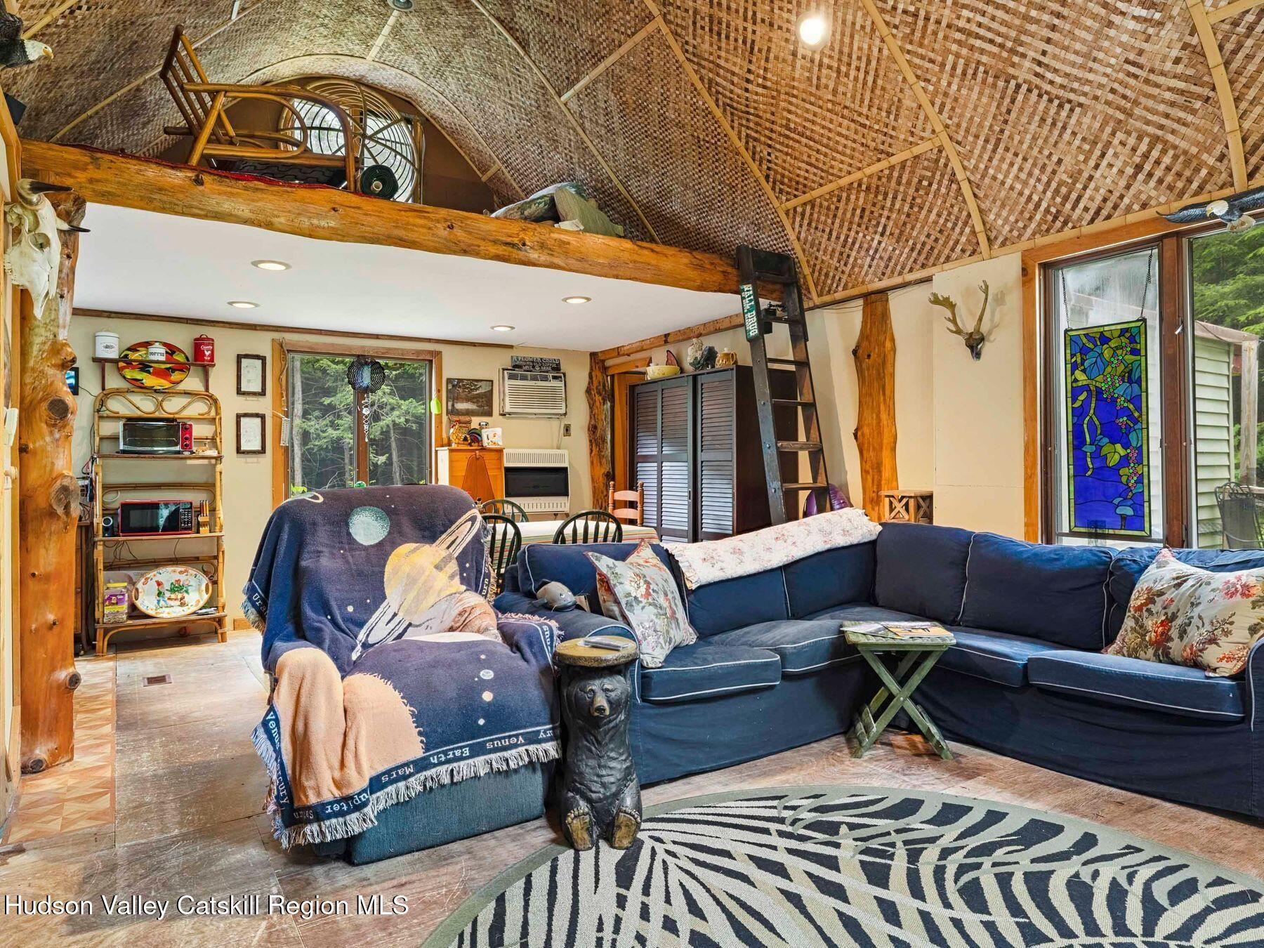 325 Brand Road Conesville, NY 12076 - Photo 9 of 36 a outdoor living space with furniture and a fireplace