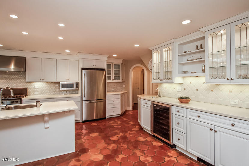 35 Willow Road Riverside, CT 06878 - Photo 14 of 35 a kitchen with refrigerator cabinets and a sink