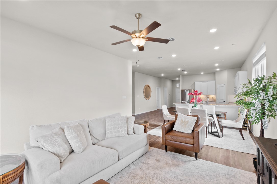 1932 Viva Road Bryan, TX 77807 - Photo 15 of 38 Living area with recessed lighting, vinyl plank floors, and a ceiling fan
