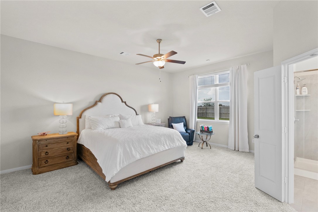 1932 Viva Road Bryan, TX 77807 - Photo 19 of 38 Bedroom with light carpet and ceiling fan