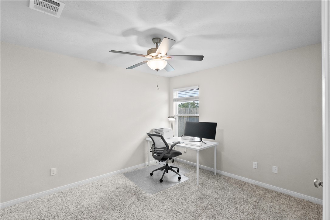 1932 Viva Road Bryan, TX 77807 - Photo 24 of 38 Bedroom 2 with ceiling fan & walk in closet