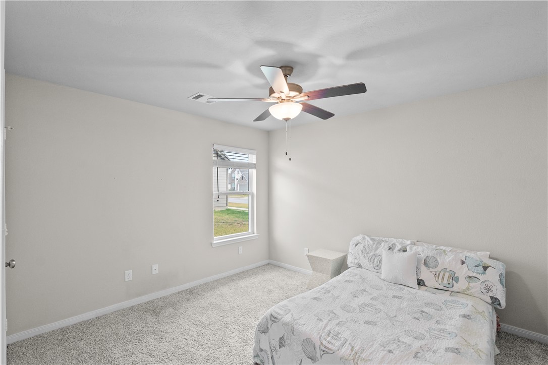 1932 Viva Road Bryan, TX 77807 - Photo 27 of 38 Bedroom 3 with ceiling fan & walk in closet