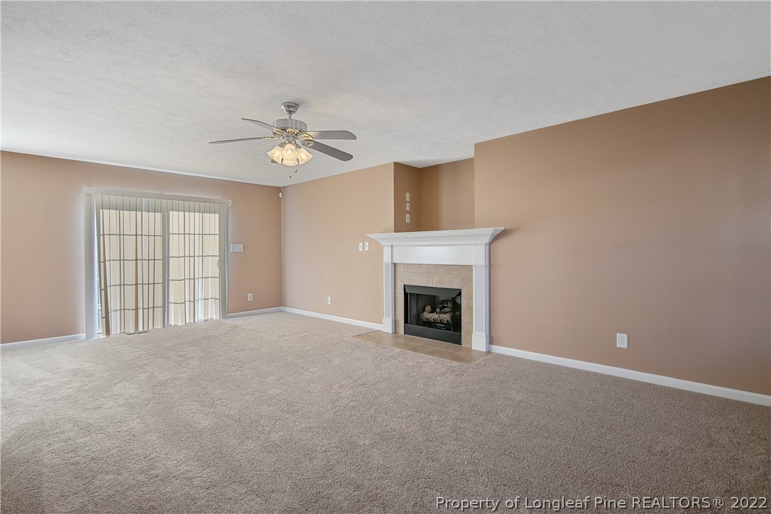 38 Rockingham Street Spring Lake, NC 28390 - Photo 11 of 50 a view of an empty room with a fireplace and a window