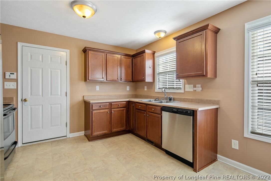 38 Rockingham Street Spring Lake, NC 28390 - Photo 17 of 50 a kitchen with stainless steel appliances granite countertop a sink stove and granite countertops
