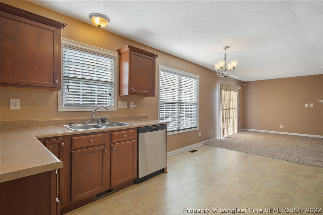 38 Rockingham Street Spring Lake, NC 28390 - Photo 20 of 50 a spacious bathroom with double vanity and a mirror
