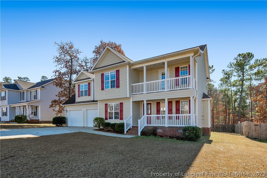 38 Rockingham Street Spring Lake, NC 28390 - Photo 2 of 50 a front view of a house with garden