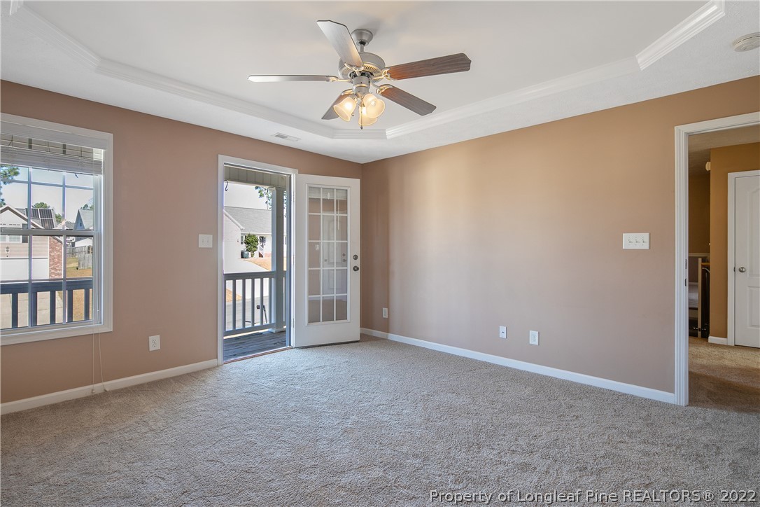 38 Rockingham Street Spring Lake, NC 28390 - Photo 24 of 50 a view of an empty room with chandelier fan and a window