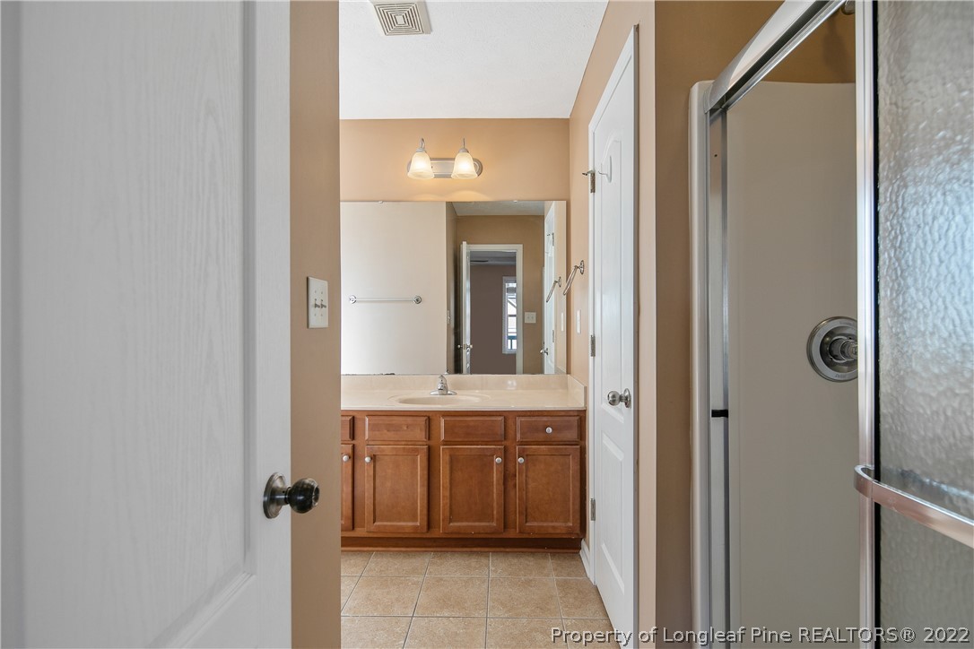 38 Rockingham Street Spring Lake, NC 28390 - Photo 28 of 50 a view of a bathroom from a hallway