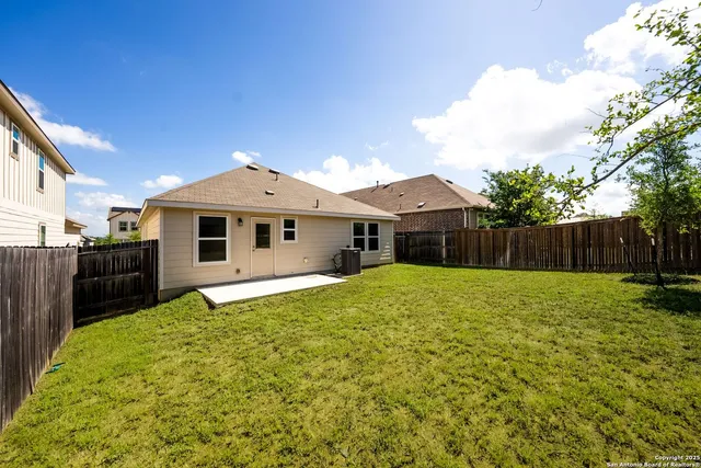 a front view of a house with yard and garage