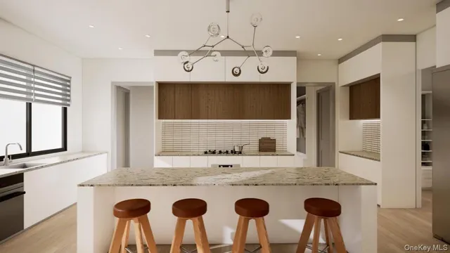 a kitchen with a kitchen island a stove a table and chairs in it