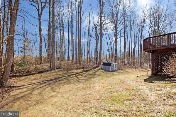 a view of a backyard of the house