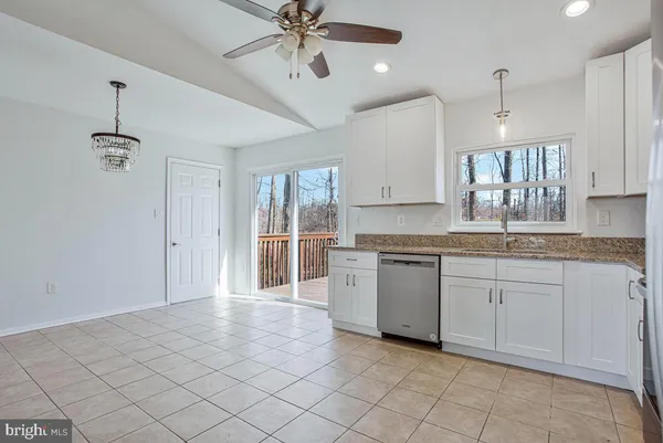 a kitchen with a stove a sink and a refrigerator