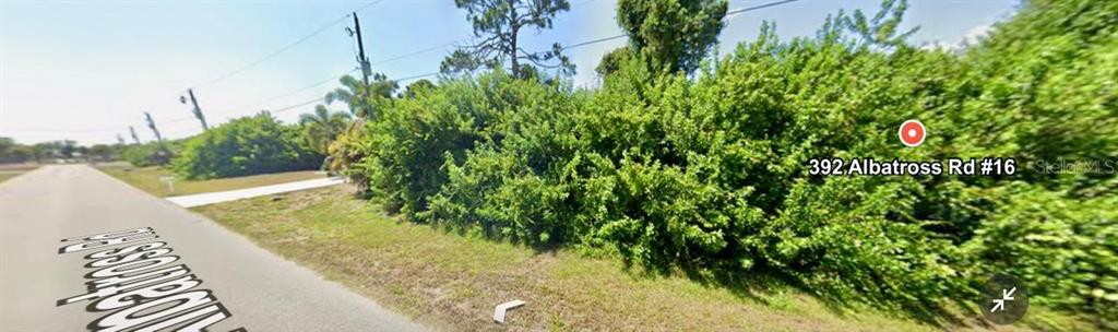 392 Albatross Road Rotonda West, FL 33947 - Photo 4 of 7 a view of a garden with plants
