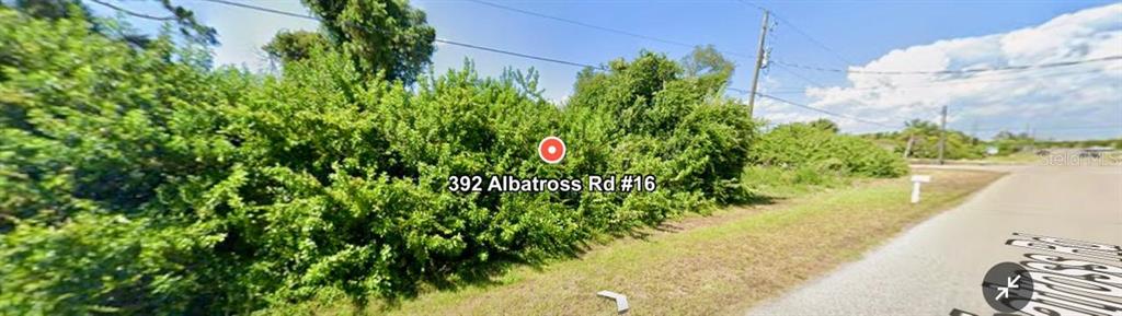 392 Albatross Road Rotonda West, FL 33947 - Photo 5 of 7 a view of a garden