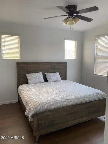 a bedroom with a bed and window