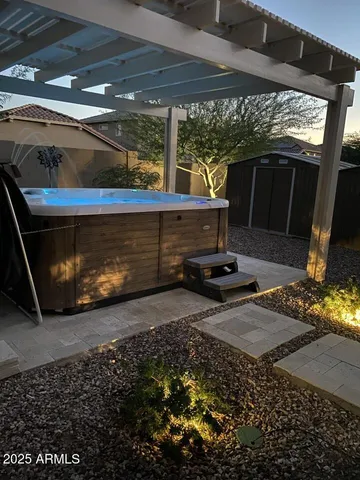 a view of a balcony with a floor to ceiling window next to yard