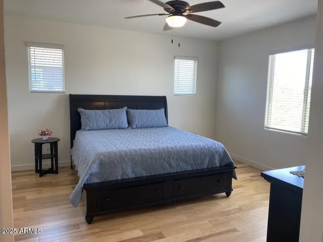 a bedroom with a bed and window