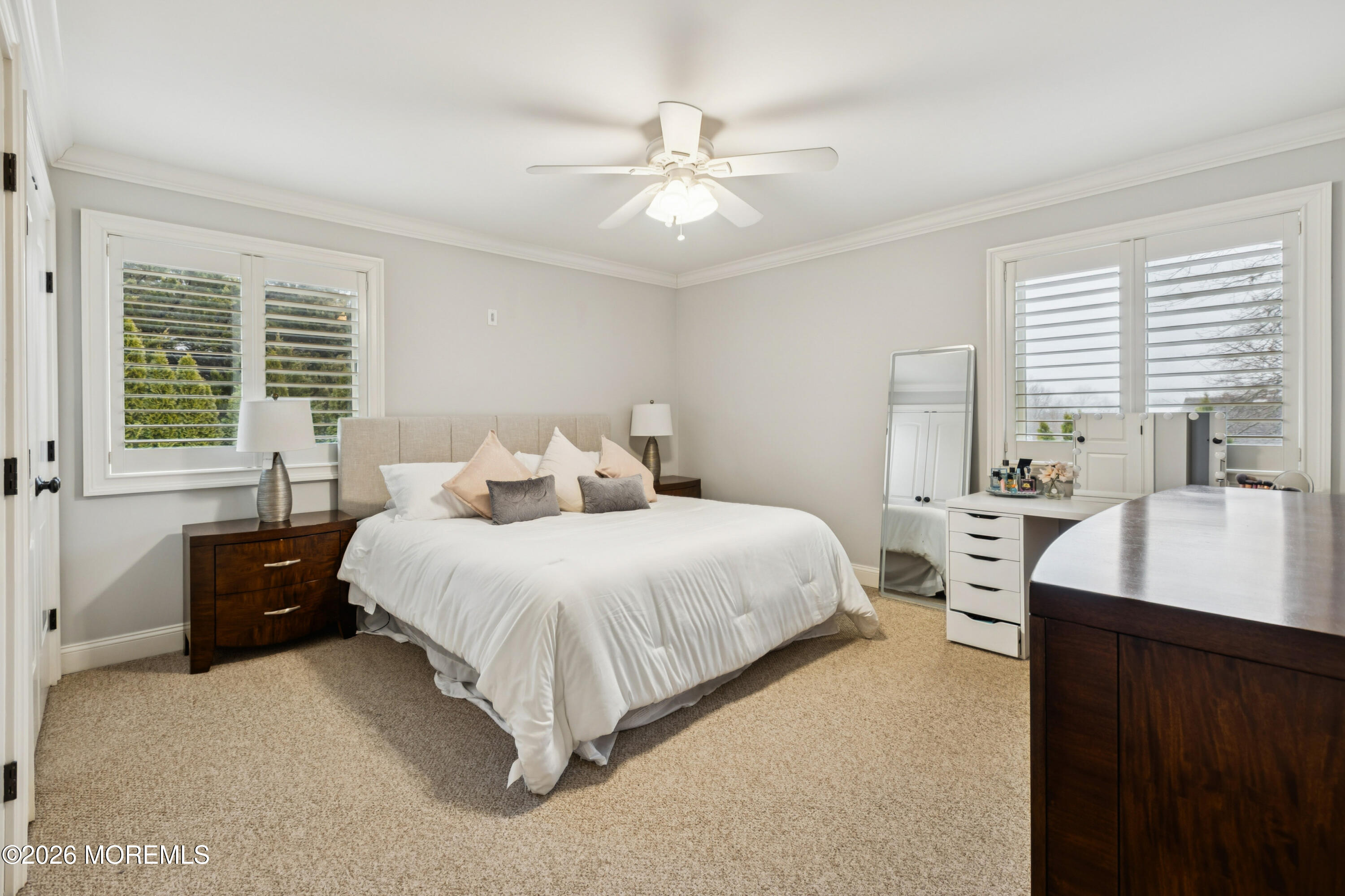 40 Pinyon Street Howell, NJ 07731 - Photo 13 of 29 a bedroom with a bed and a chandelier