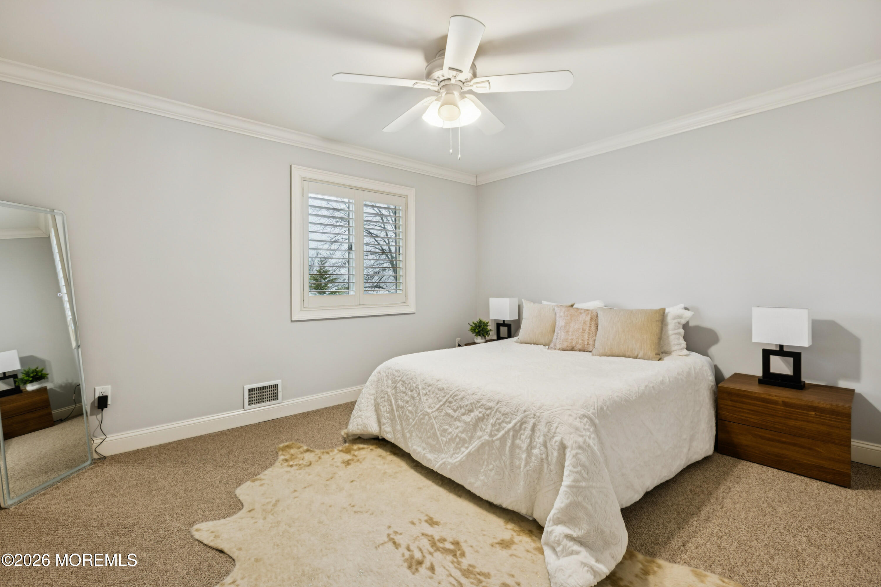 40 Pinyon Street Howell, NJ 07731 - Photo 14 of 29 a bedroom with a bed and a chandelier