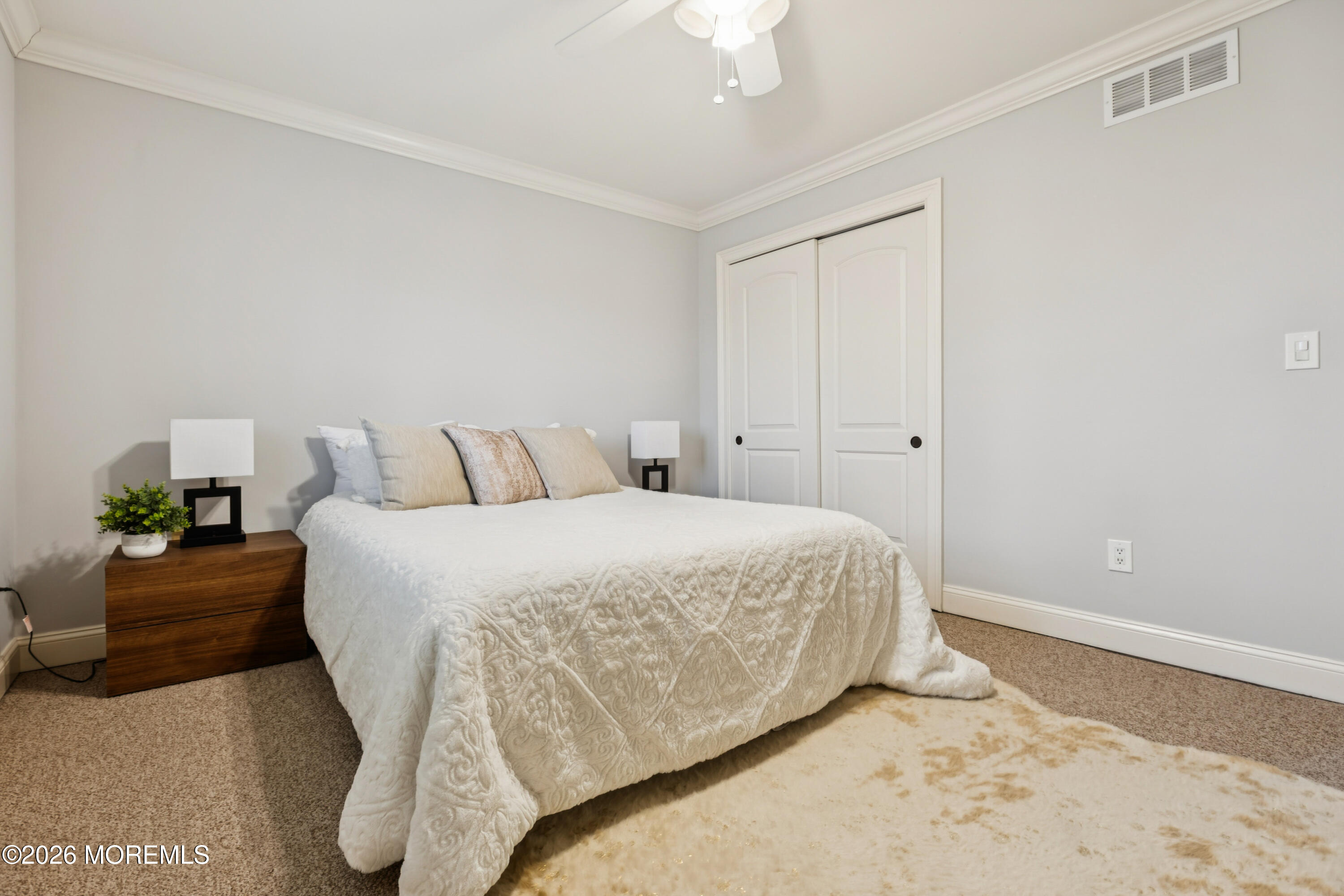 40 Pinyon Street Howell, NJ 07731 - Photo 15 of 29 a bedroom with a bed and a potted plant