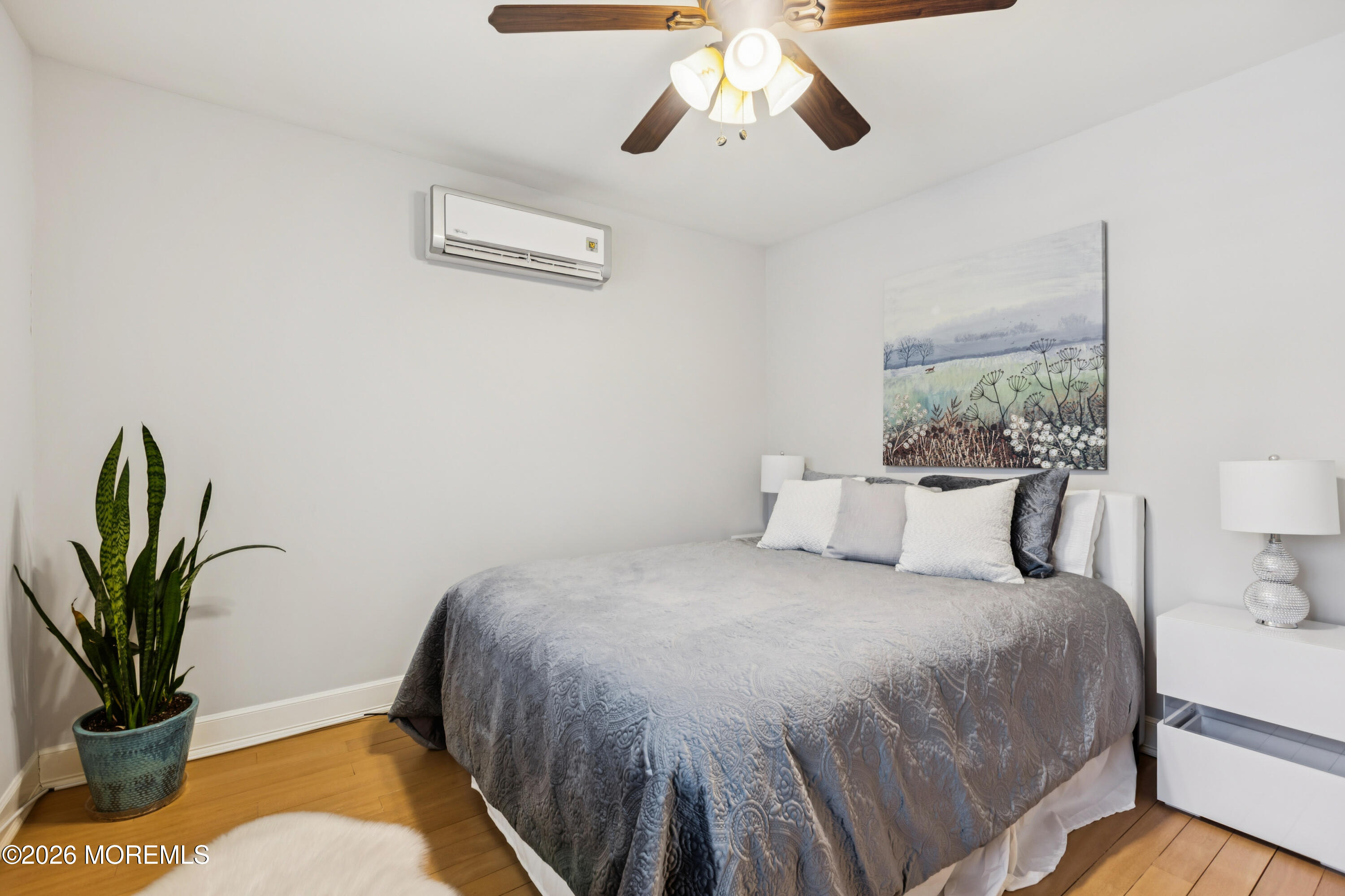 40 Pinyon Street Howell, NJ 07731 - Photo 18 of 29 a bedroom with a bed and a potted plant