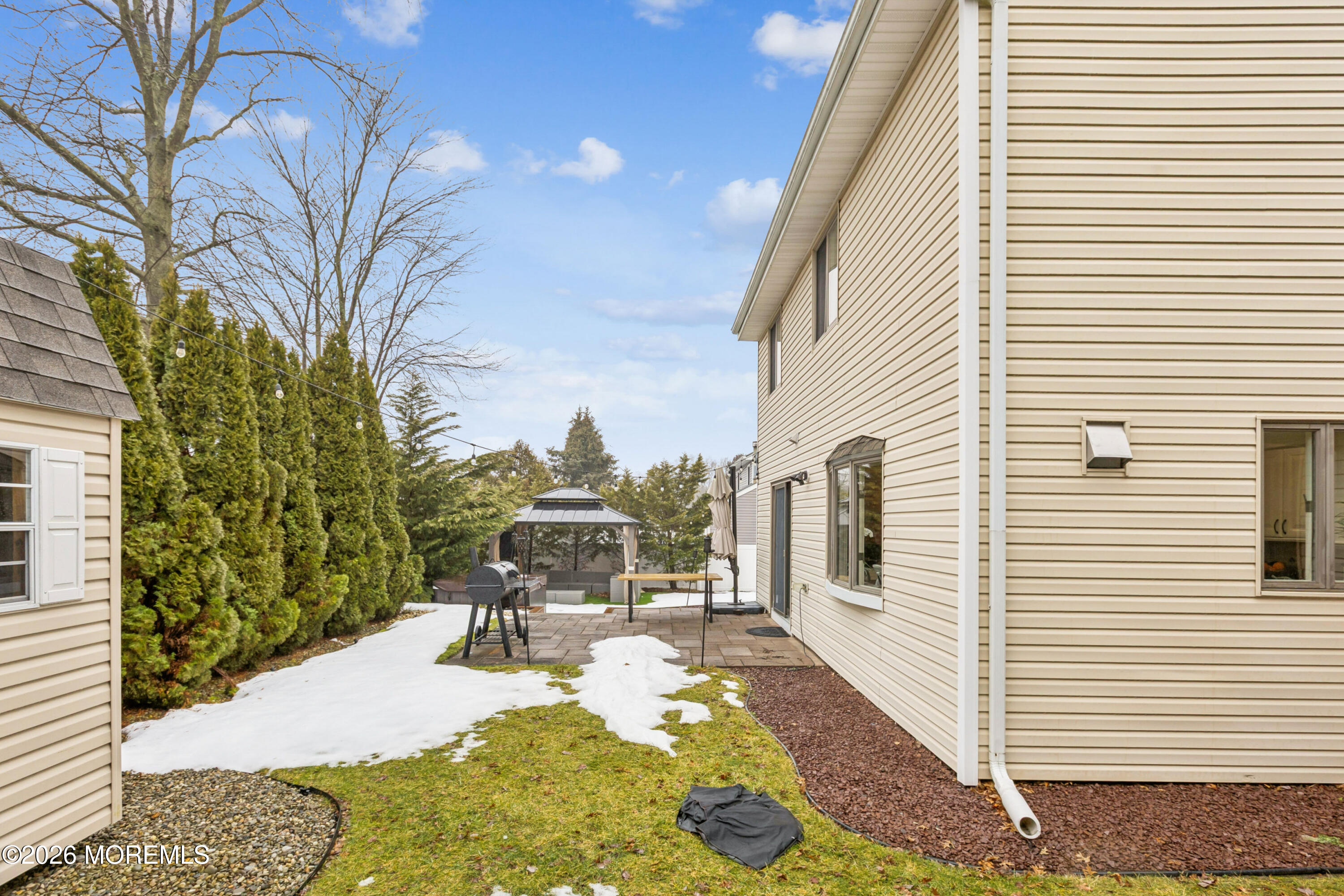 40 Pinyon Street Howell, NJ 07731 - Photo 25 of 29 a view of a patio with chair and tables