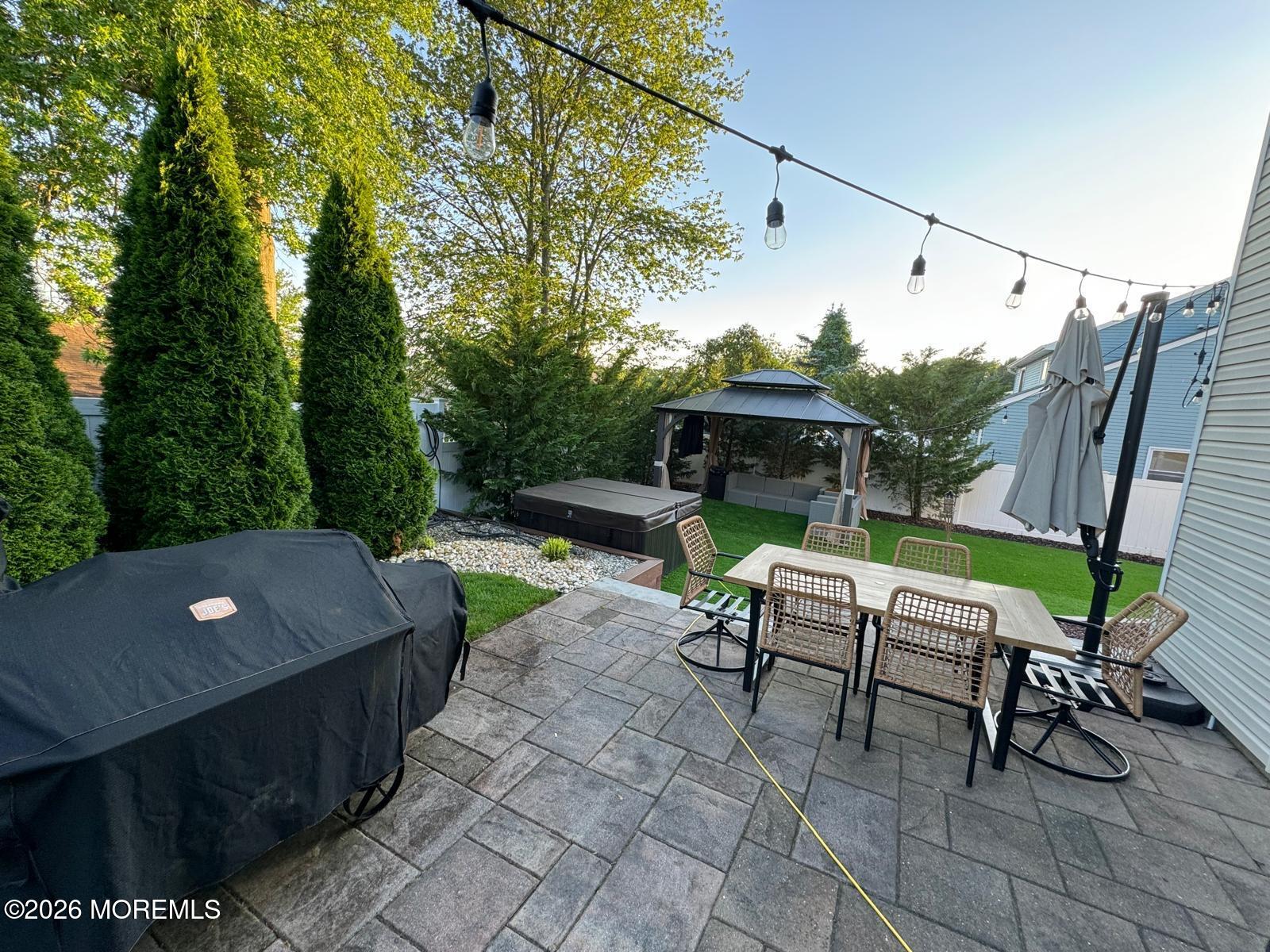 40 Pinyon Street Howell, NJ 07731 - Photo 26 of 29 a view of a patio with a table and chairs