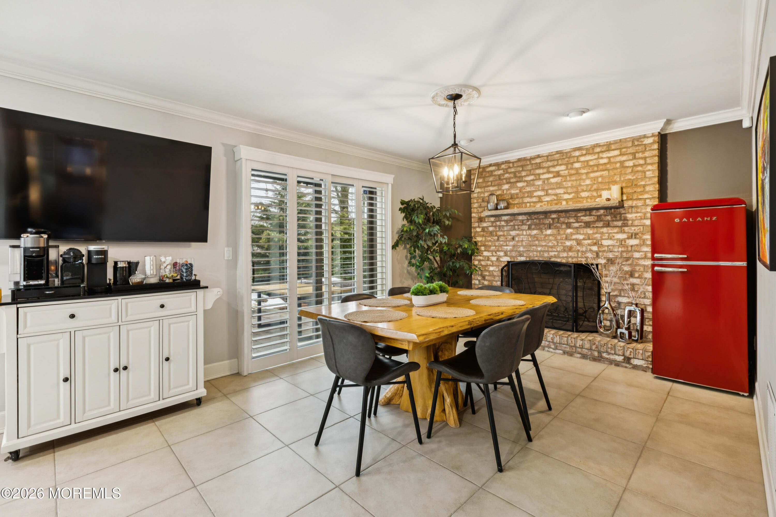 40 Pinyon Street Howell, NJ 07731 - Photo 7 of 29 a kitchen with a table chairs refrigerator and cabinets