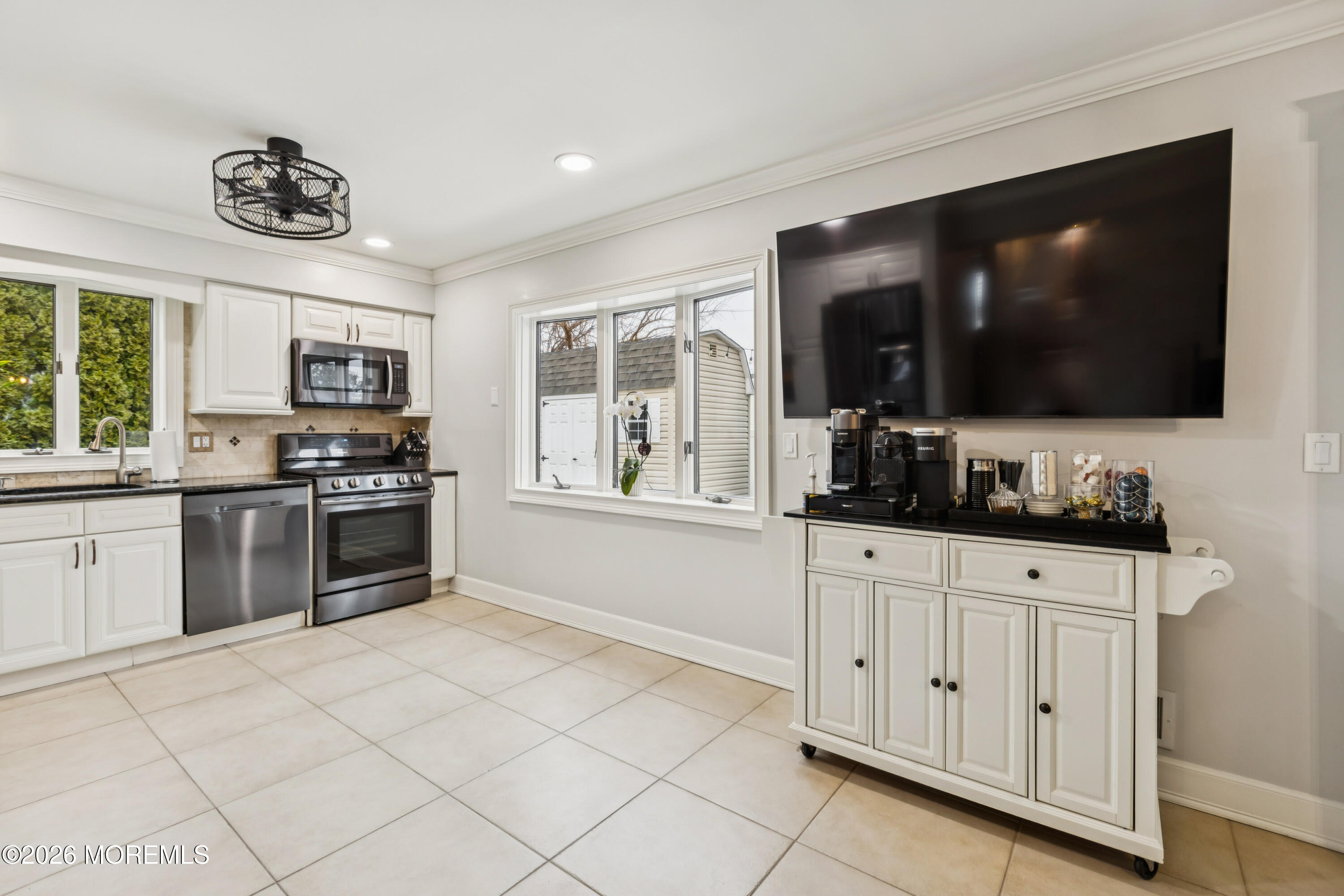 40 Pinyon Street Howell, NJ 07731 - Photo 10 of 29 a kitchen with granite countertop a stove and a sink