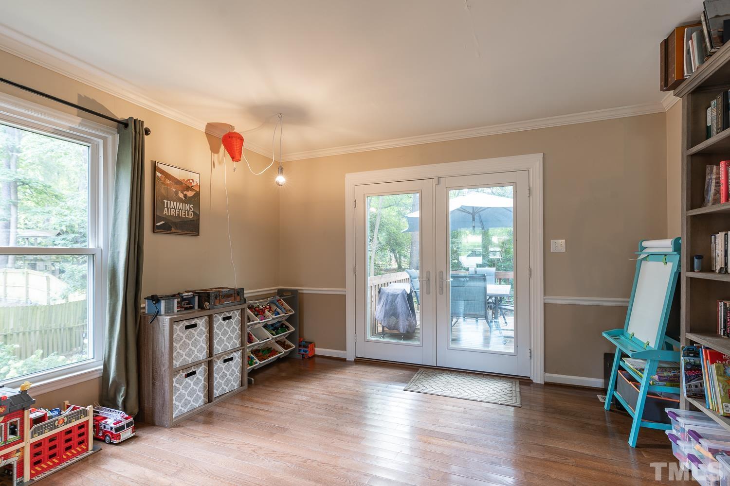 8112 Bentwood Place Raleigh, NC 27615 - Photo 20 of 24 a view of a livingroom with furniture and a flat screen tv