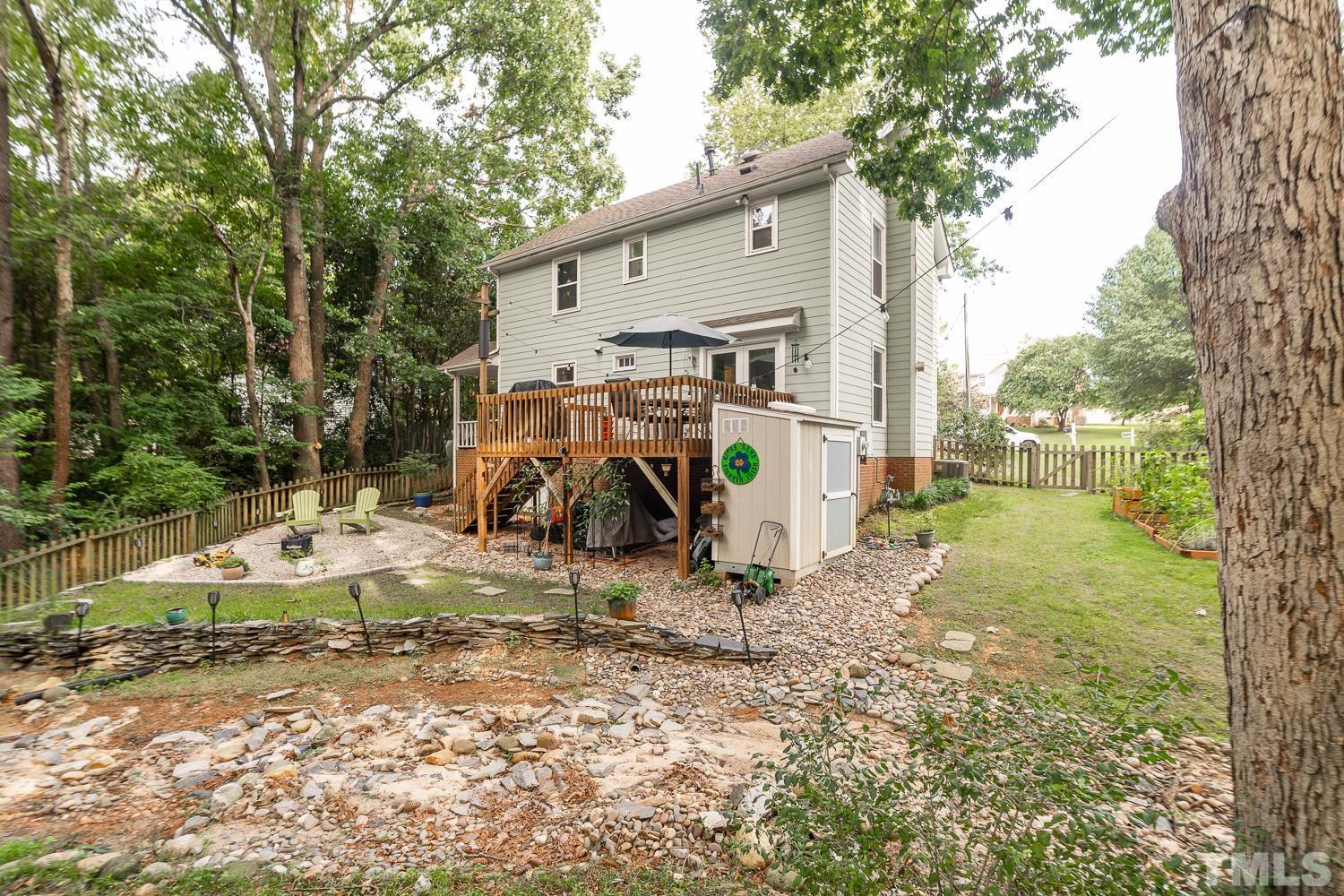 8112 Bentwood Place Raleigh, NC 27615 - Photo 7 of 24 a view of a house with backyard