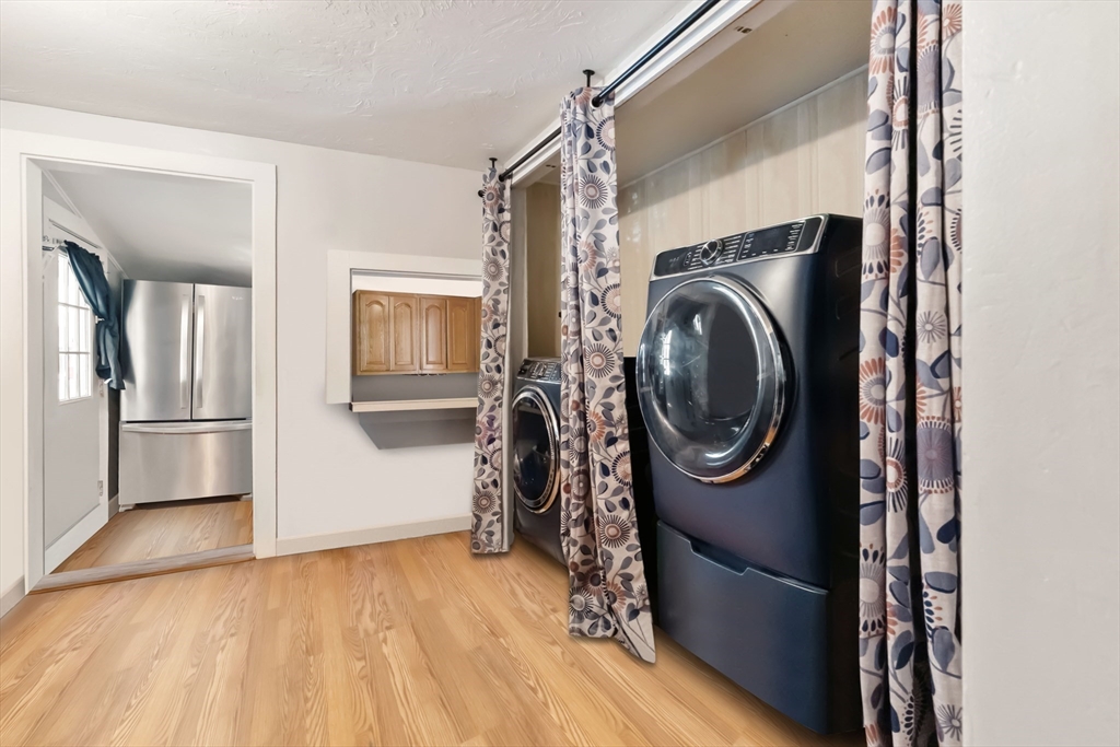 548 Delano Road Marion, MA 02738 - Photo 4 of 18 a utility room with closet dryer and washer