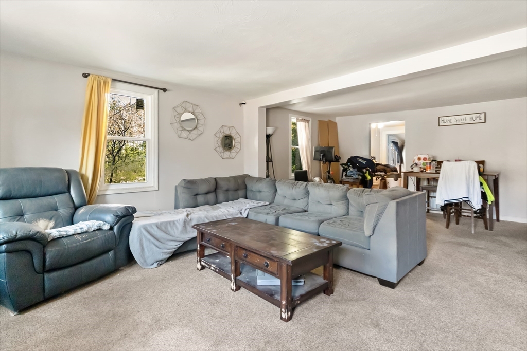 548 Delano Road Marion, MA 02738 - Photo 6 of 18 a living room with furniture and a large window