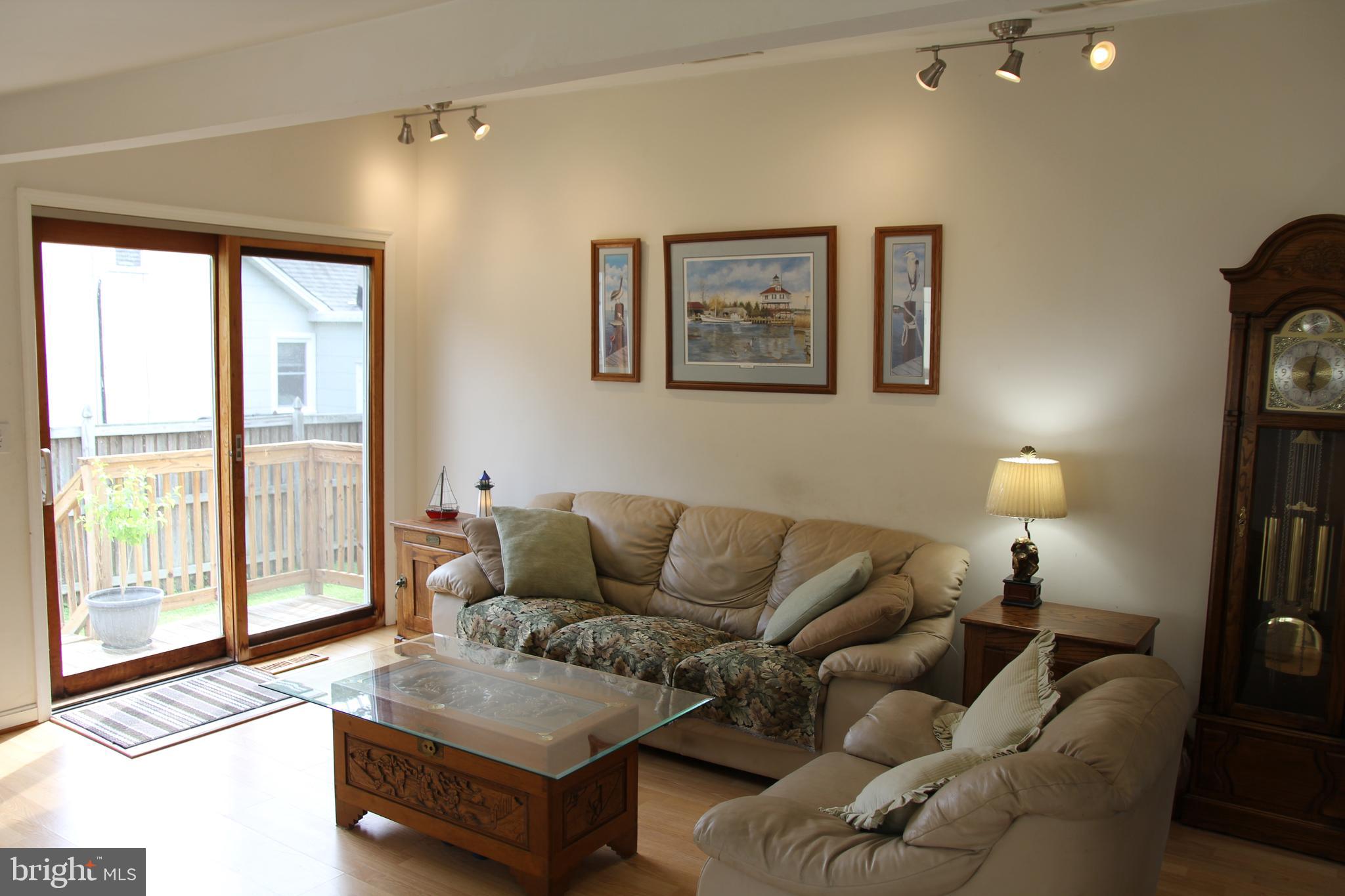 Family room with vaulted ceiling and natural light