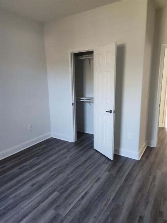 20008 Boggy Ford Road Lago Vista, TX 78645 - Photo 11 of 17 a view of a room with wooden floor and closet